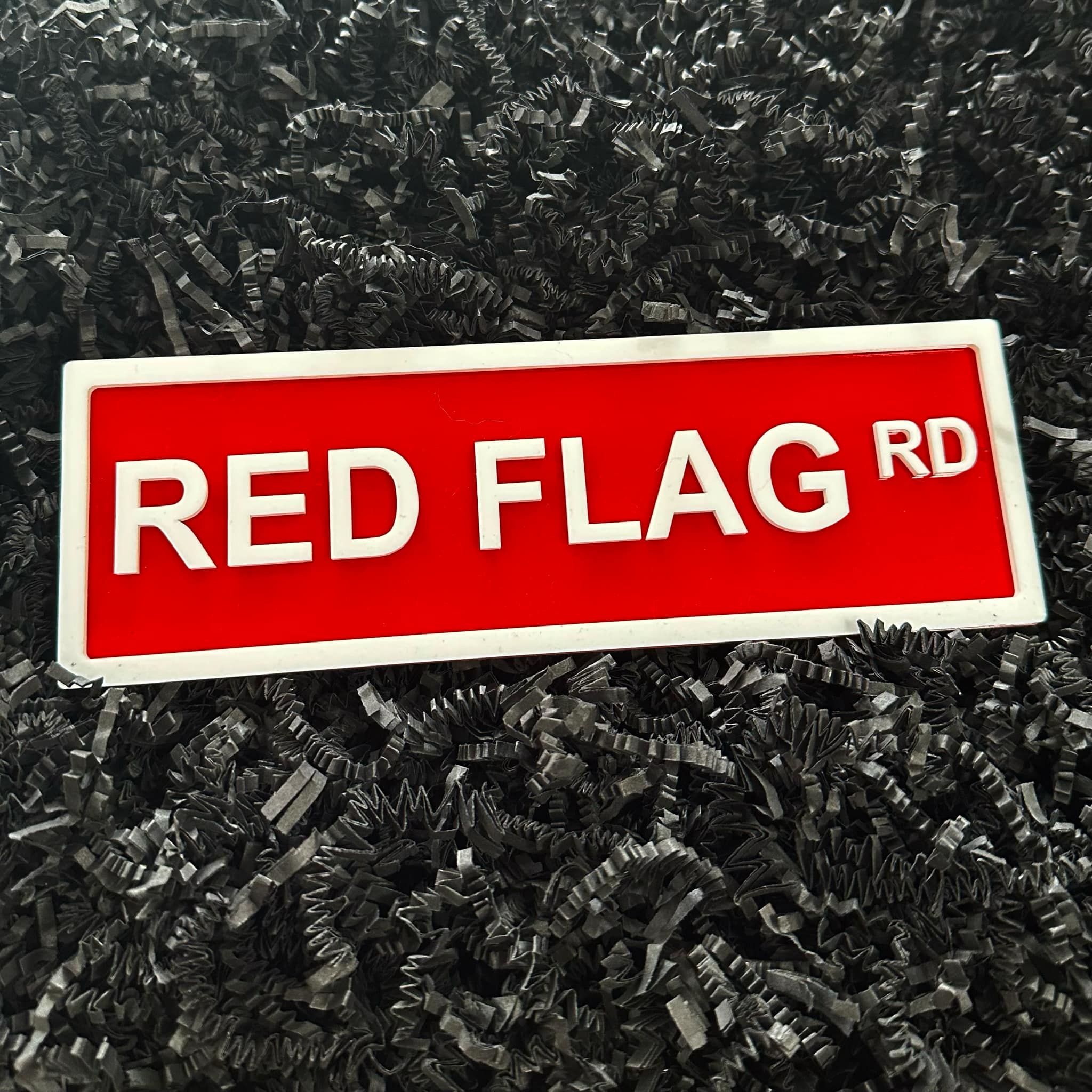 Red Flag Rd Shelf Sign